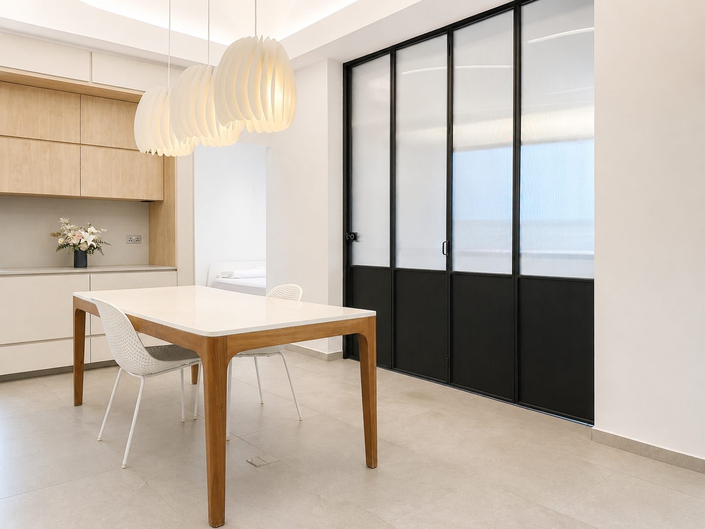 The dining room and the black-framed glass partition